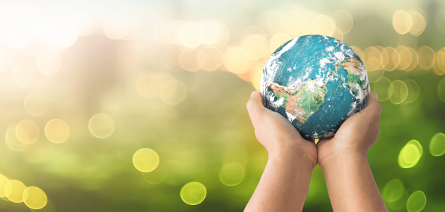 hands supporting world through planned giving