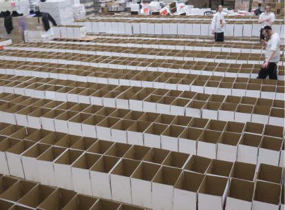 filling boxes for Reb Meir tzedakah food distribution