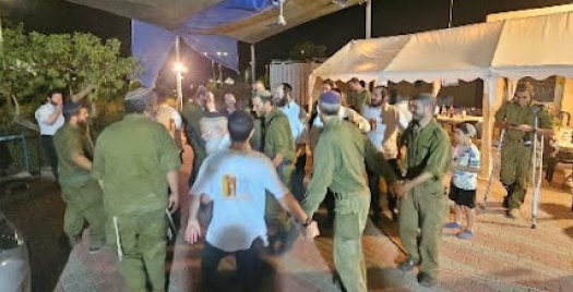 Dancing at barbecue feeding the IDF chayalim